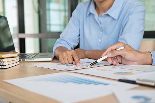 Start up partners are working in casual clothes, discussing the