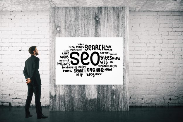 Man with SEO sketch User Experience in SEO Muzeum