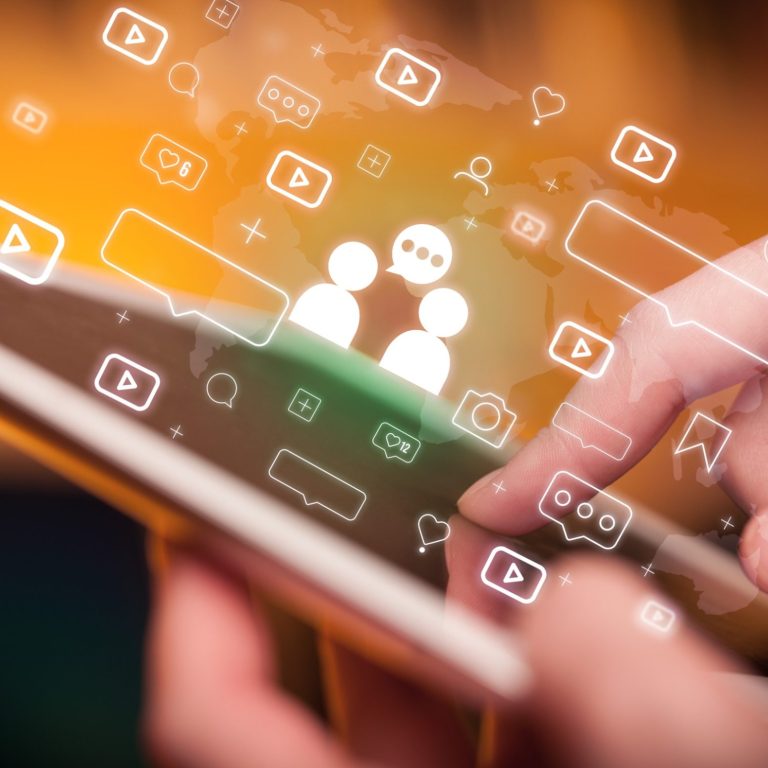 Close-up of a hand using tablet, social media concept